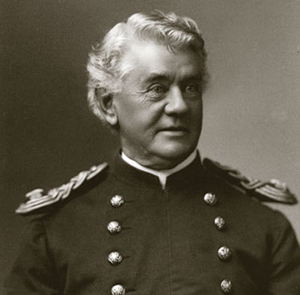 Photo of Captain Benteen. He has a boyish face 
but his hair is long and white.