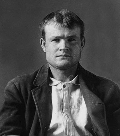 Photo of Butch Cassidy. He appears clean-cut.